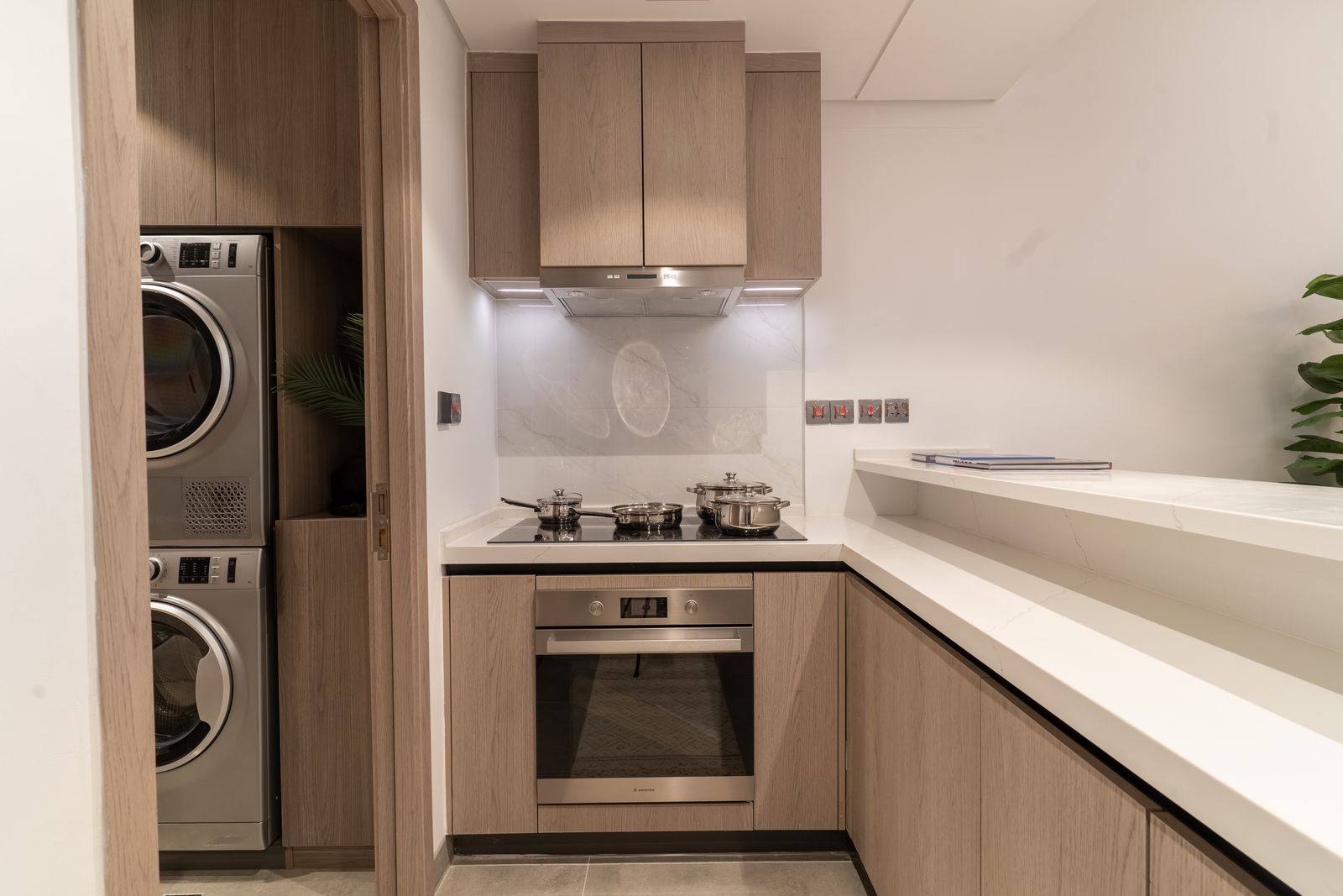 Al Alyaa show apartment kitchen with laundry
